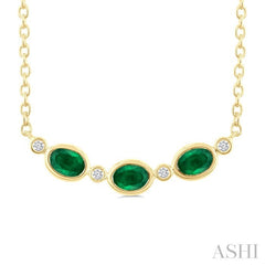 4X3 MM Oval Cut Emerald and 1/50 Ctw Bezel Set Round Cut Diamond Precious Fashion Necklace in 10K Yellow Gold