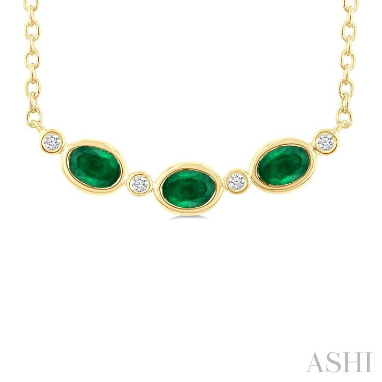 4X3 MM Oval Cut Emerald and 1/50 Ctw Bezel Set Round Cut Diamond Precious Fashion Necklace in 10K Yellow Gold