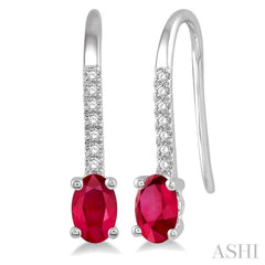 1/20 Ctw Round Cut Diamond and Oval Cut 5x3 MM Ruby Precious Earrings in 10K White Gold