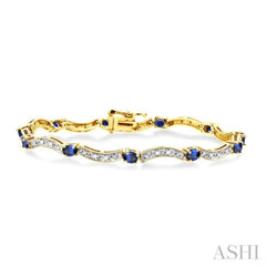 4x3 MM Oval Cut Sapphire and 1/10 Ctw Single Cut Diamond Bracelet in 14K Yellow Gold