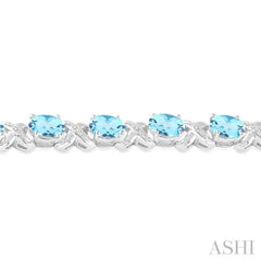 7x5  MM Oval Cut Blue Topaz and 1/20 Ctw Round Cut Diamond Fashion Bracelet in Sterling Silver