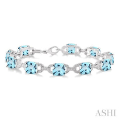 7x7  MM Cushion Shape Blue Topaz and 1/20 Ctw Round Cut Diamond Fashion Bracelet in Sterling Silver