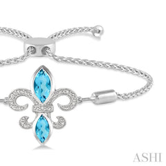 1/20 Ctw Round Diamond and Marquise 10x5 MM & 8x4 MM Blue Topaz Fleur De Lis Sterling Silver Lariat Bracelet