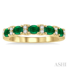 1/6 Ctw Oval Shape 4x3 MM Emerald and Round Cut Diamond Precious Band in 14K Yellow Gold