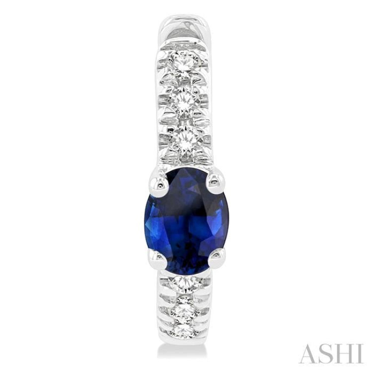 4X3 MM Oval Cut Sapphire and 1/10 Ctw Petite Round Cut Diamond Fashion Huggies in 10K White Gold