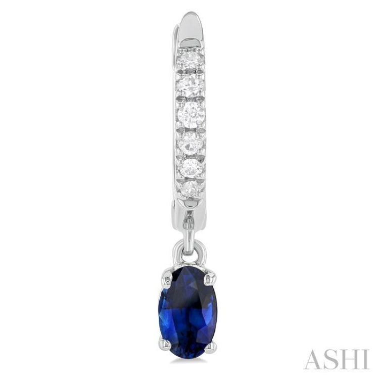 5x3 MM Oval Cut Sapphire and 1/8 Ctw Petite Round Cut Diamond Precious Fashion Huggies in 10K White Gold